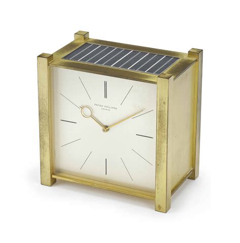 Patek Philippe. A gilt brass square solar